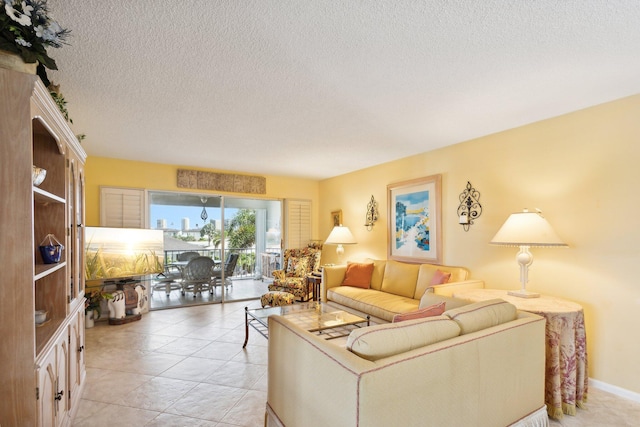 tiled living room featuring a textured ceiling