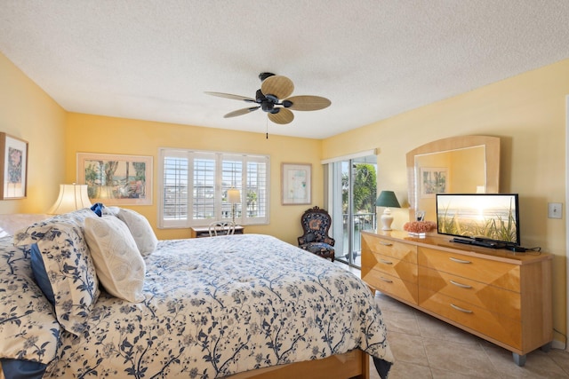 bedroom featuring access to exterior, light tile patterned floors, a textured ceiling, and ceiling fan