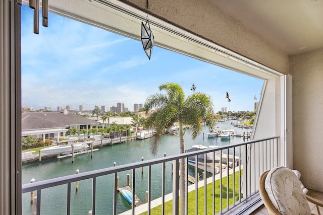 balcony featuring a water view