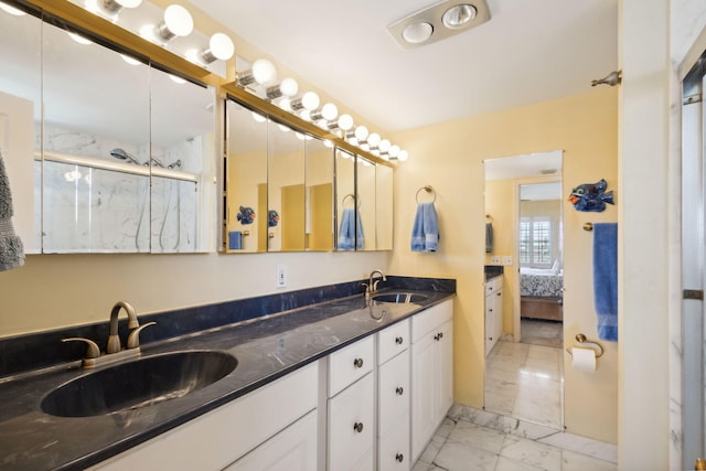 bathroom featuring vanity and a shower with door