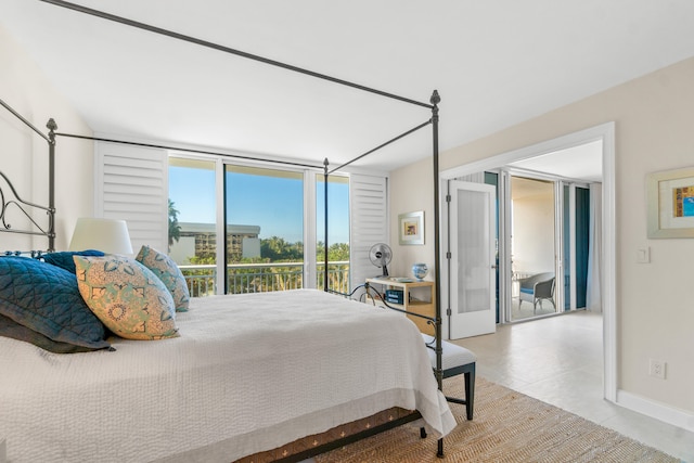 tiled bedroom featuring access to exterior