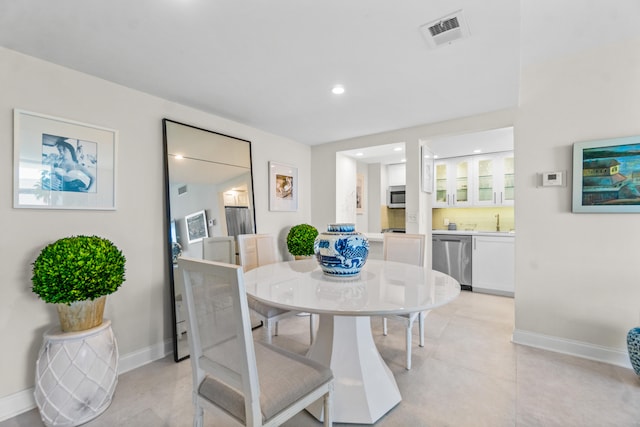 tiled dining area with sink