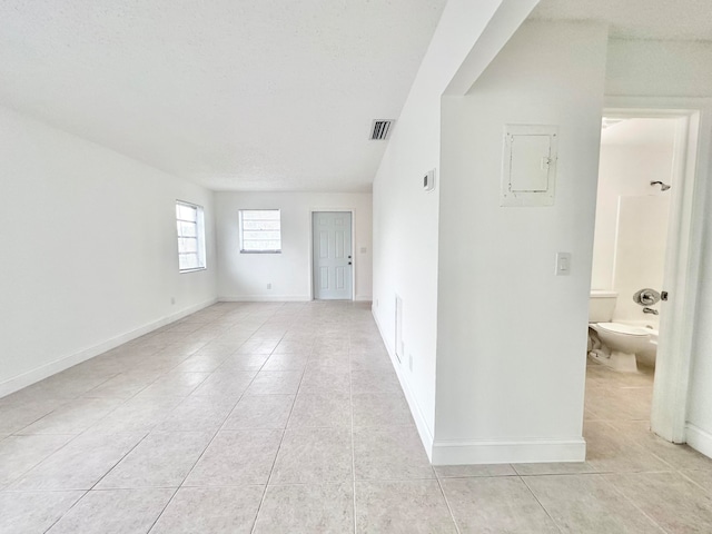 empty room featuring light tile floors