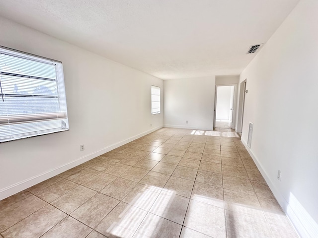 empty room with light tile flooring