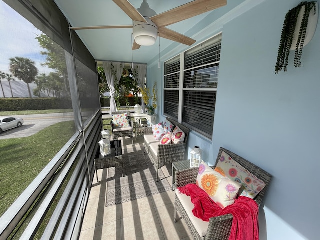 wooden deck featuring a porch and ceiling fan