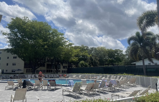 view of swimming pool with a patio