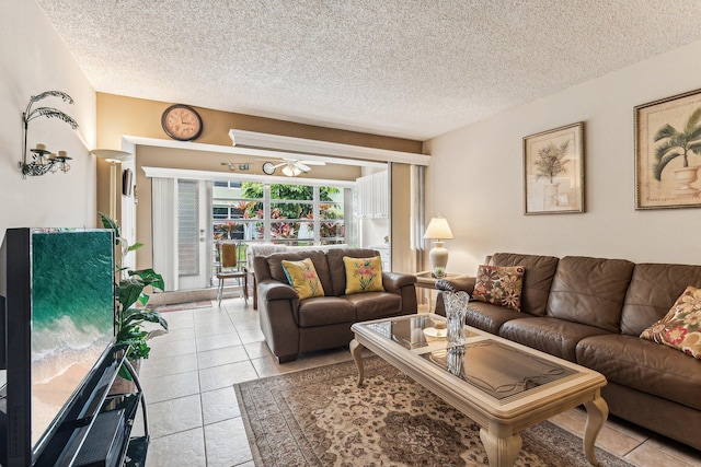 living room featuring light tile floors and a textured ceiling