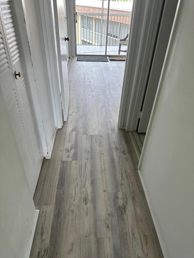 corridor with wood finished floors