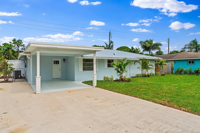 ranch-style house with a front lawn and a carport