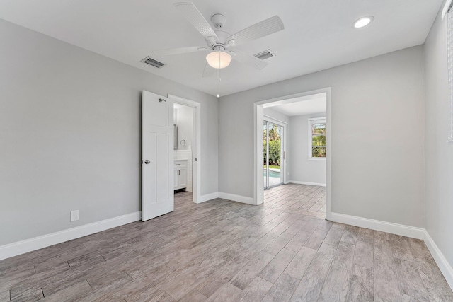 empty room featuring light hardwood / wood-style flooring and ceiling fan