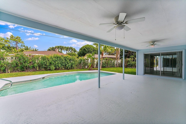 view of pool featuring a patio area, ceiling fan, and a yard