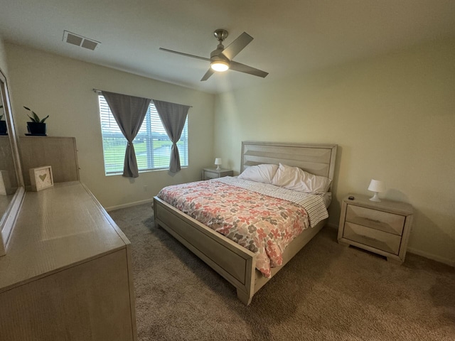 bedroom featuring ceiling fan and dark colored carpet