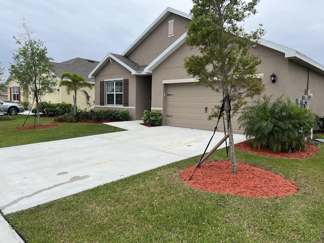 view of front of property with a front lawn and a garage