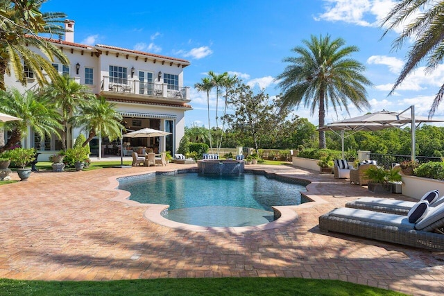 view of swimming pool with a patio area