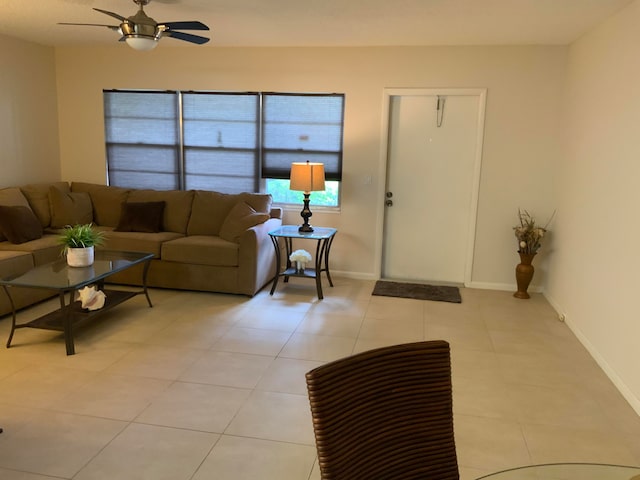 tiled living room featuring ceiling fan