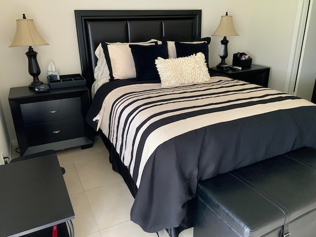 bedroom featuring light tile floors