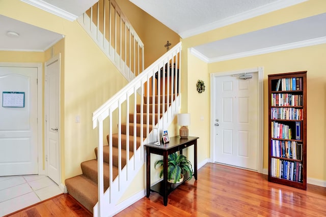 tiled foyer with ornamental molding