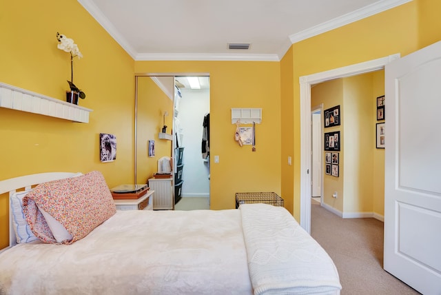 carpeted bedroom with crown molding and a closet