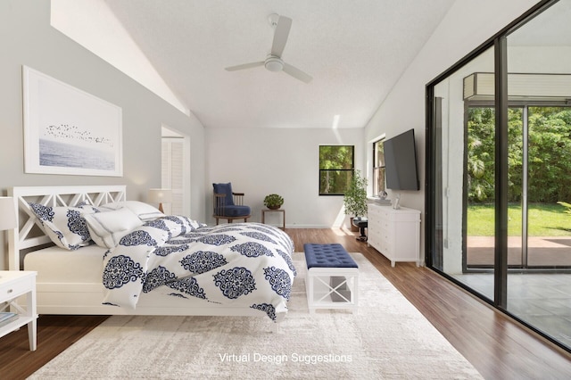 bedroom with hardwood / wood-style flooring, ceiling fan, access to outside, and vaulted ceiling