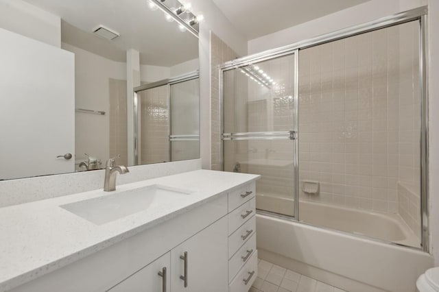 full bathroom featuring vanity, toilet, enclosed tub / shower combo, and tile flooring