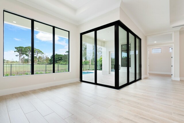 doorway to outside with light wood-type flooring