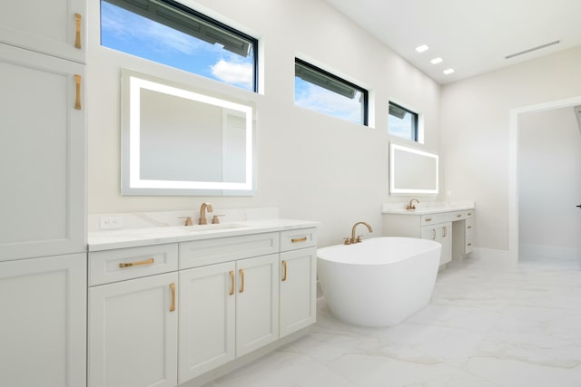 bathroom with a bathtub and vanity