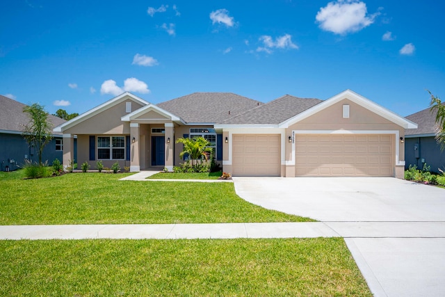 view of front of home featuring a garage and a front yard