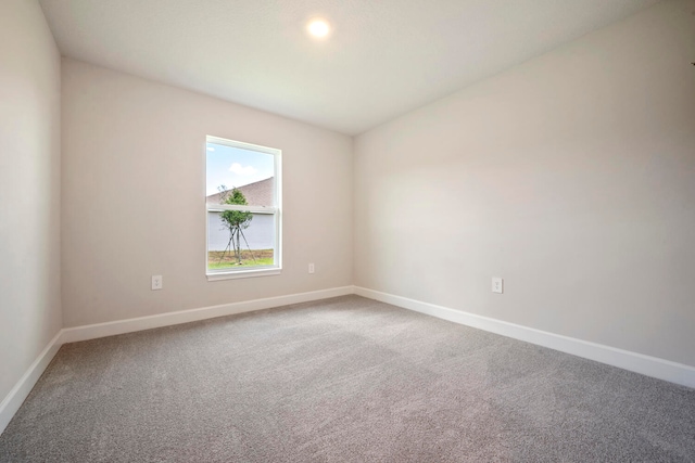 unfurnished room featuring carpet flooring