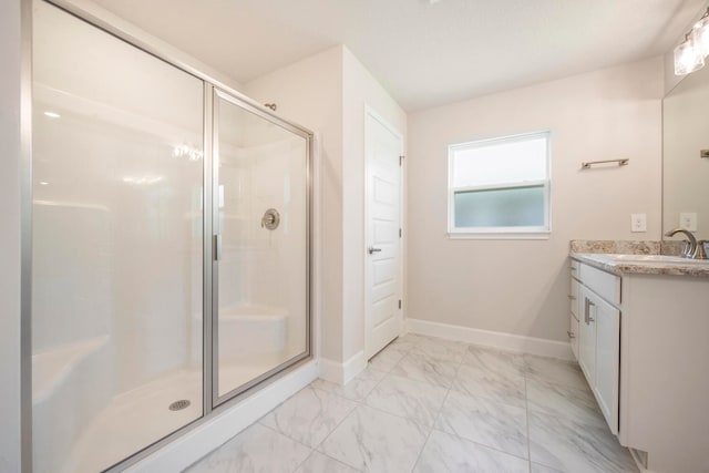 bathroom with tile floors, walk in shower, and vanity with extensive cabinet space