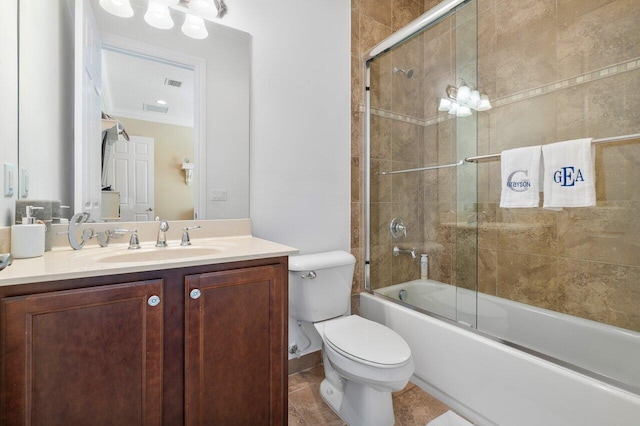 full bathroom with toilet, large vanity, shower / bath combination with glass door, ornamental molding, and tile floors