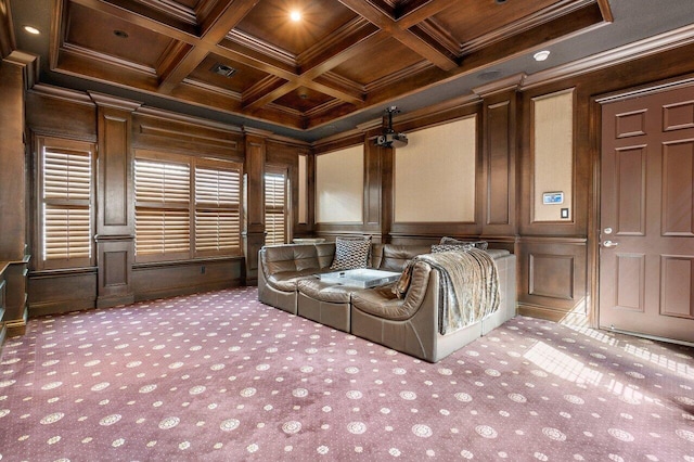 home theater room featuring coffered ceiling, dark colored carpet, and beamed ceiling