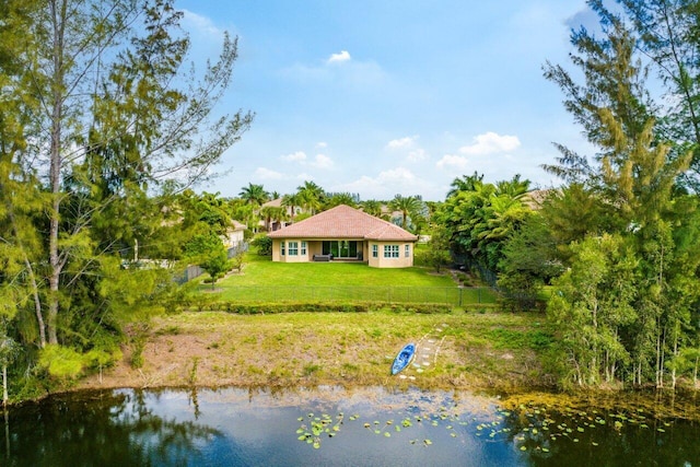 exterior space with a water view and a yard