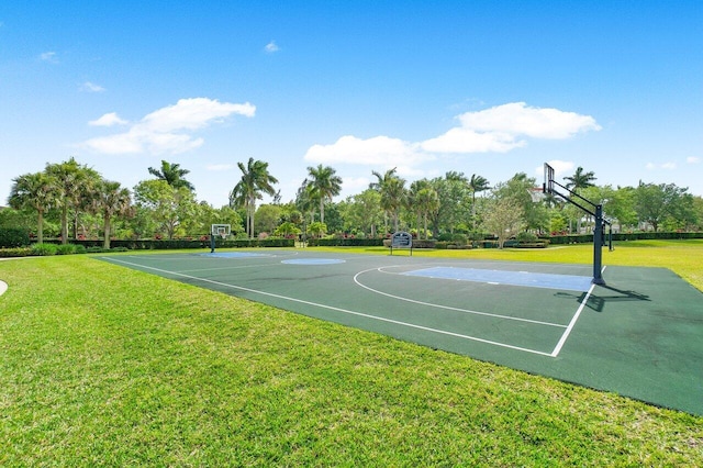 view of basketball court featuring a yard