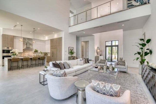 living room featuring a high ceiling