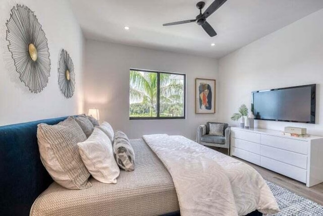 bedroom featuring light hardwood / wood-style floors and ceiling fan