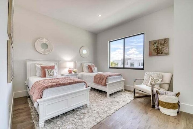 bedroom with wood-type flooring