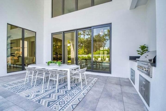 view of patio with area for grilling and an outdoor kitchen