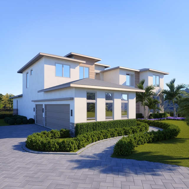 view of front facade with a garage and a front lawn