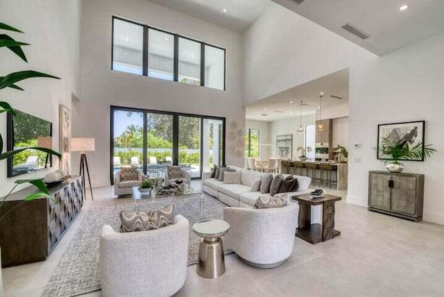 living room with a high ceiling