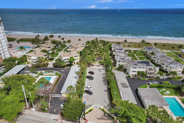 bird's eye view with a water view and a view of the beach