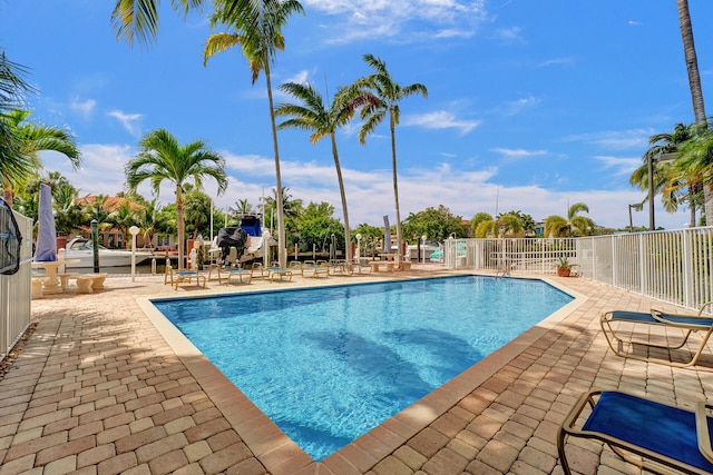 view of swimming pool with a patio