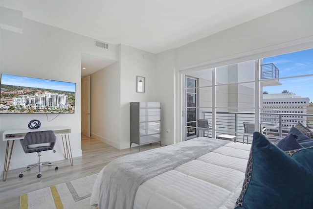 bedroom with light hardwood / wood-style floors