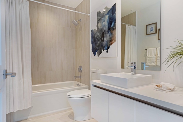 full bathroom featuring shower / bath combo, vanity, and toilet