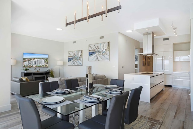 dining area with light hardwood / wood-style floors