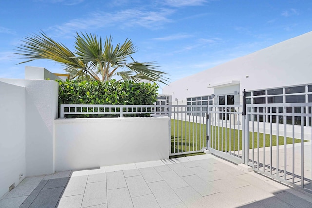 view of patio featuring a balcony