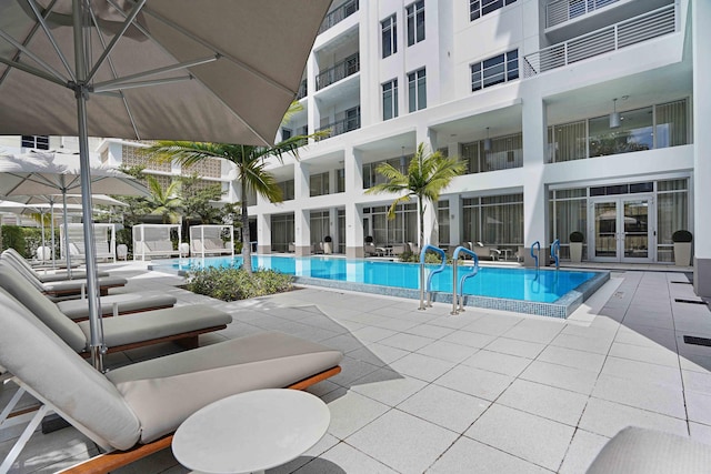 view of swimming pool featuring a patio area