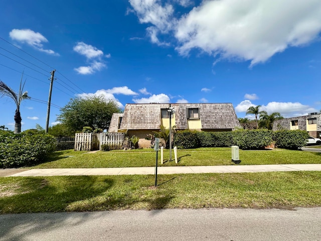 view of front of home with a front lawn