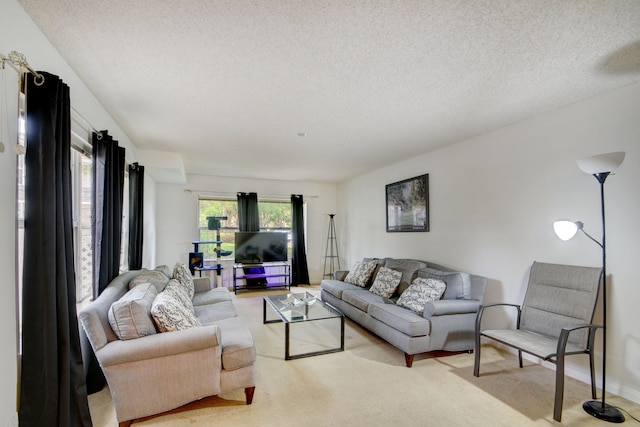 living room with light carpet and a textured ceiling