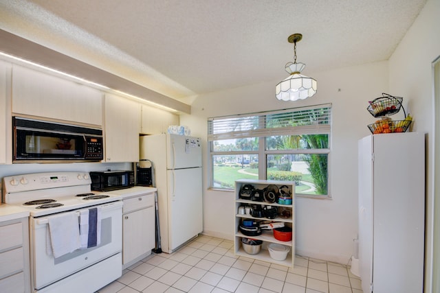 kitchen featuring a textured ceiling, white appliances, light tile flooring, and pendant lighting