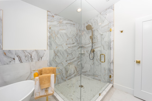 bathroom featuring separate shower and tub and tile patterned flooring